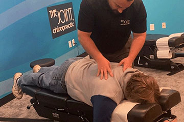 The Joint Chiropractic Christiansburg Patient Adjustment