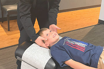 The Joint Chiropractic Clear Lake Patient Adjustment