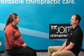 The Joint Chiropractic Wasilla Doctor and Patient