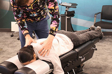 The Joint Chiropractic Rogers Patient Adjustment