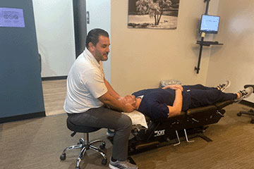 The Joint Chiropractic Greenlawn Patient Adjustment