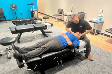 The Joint Chiropractic Kingwood Patient Adjustment