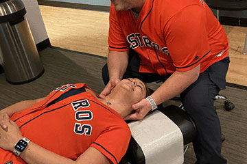 The Joint Chiropractic Kingwood Patient Adjustment