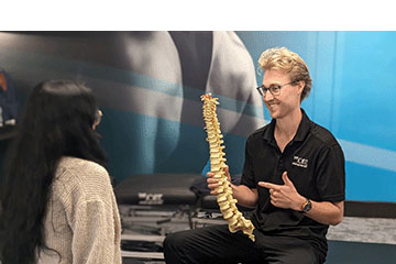 The Joint Chiropractic Vintage Park Staff and Patient