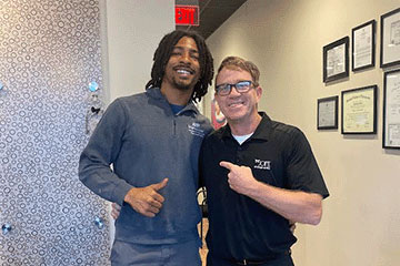 The Joint Chiropractic Clarksville Staff and Patient
