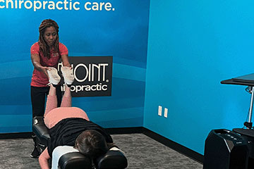Chiropractor adjusting patient at The Joint Chiropractic Bellevue