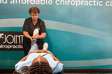 The Joint Chiropractic Monroe Patient Adjustment