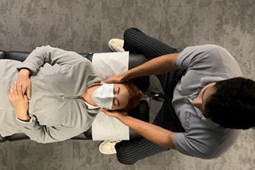 Chiropractor giving patient adjustment at The Joint Chiropractic Thousand Oaks