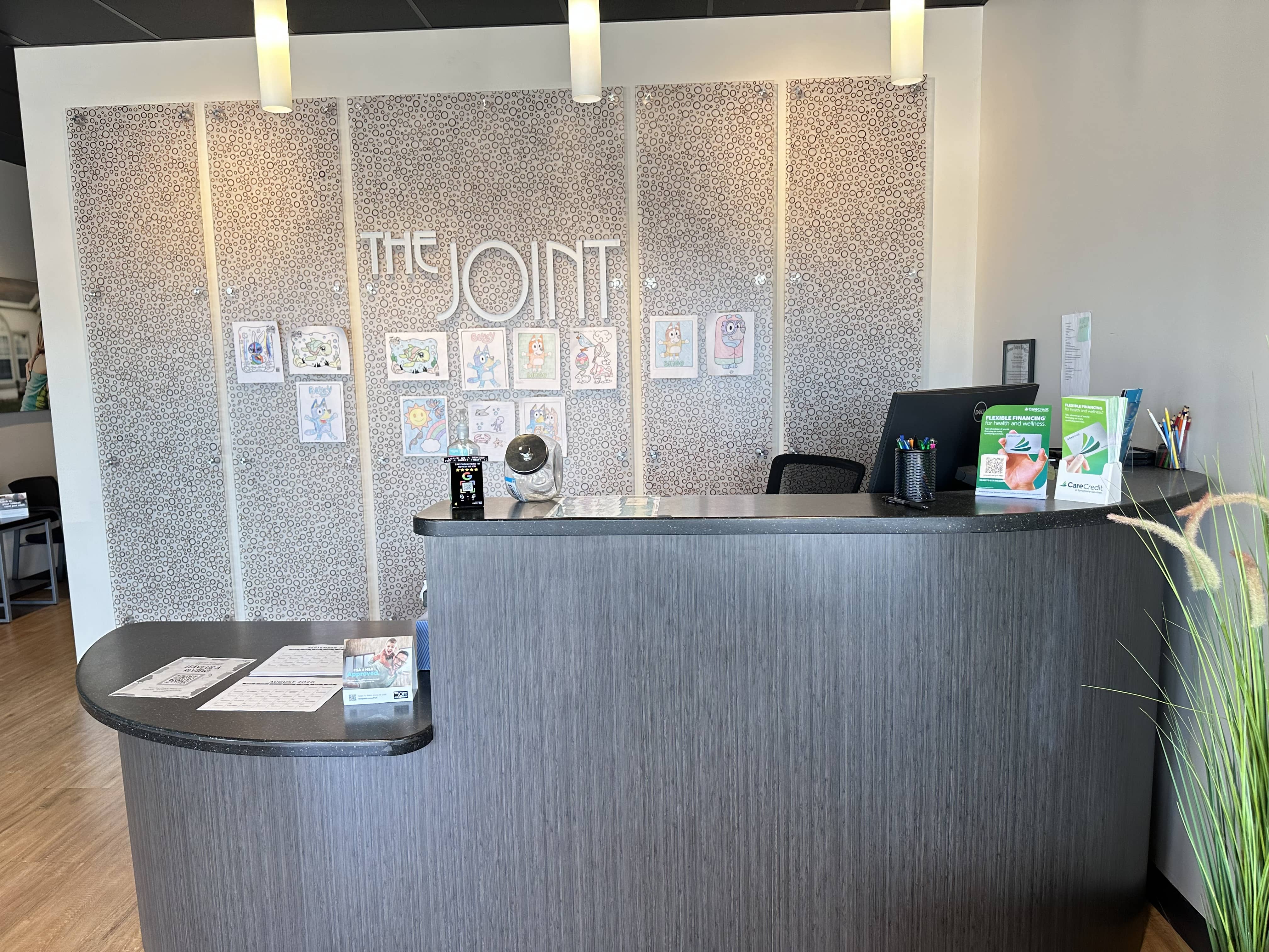 Front desk inside The Joint Chiropractic – Bowling Green in Bowling Green, Kentucky, where patients 