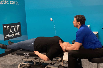 The Joint Chiropractic Wasilla Patient Adjustment