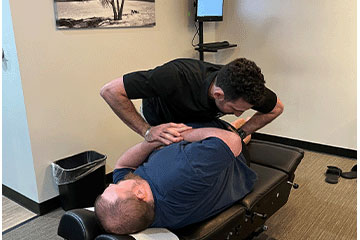 The Joint Chiropractic Greenlawn Patient Adjustment