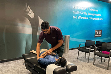 Chiropractor giving patient adjustment at The Joint Chiropractic Thousand Oaks