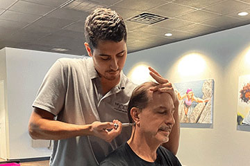 Chiropractor giving patient adjustment at The Joint Chiropractic Thousand Oaks