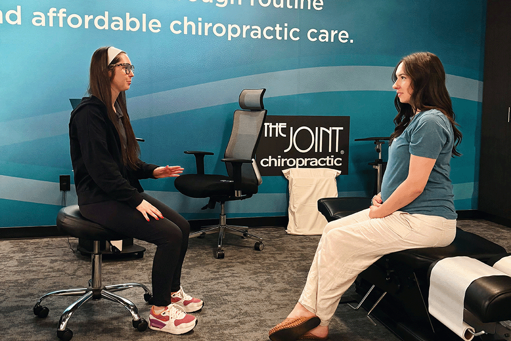 The Joint Chiropractic Springdale  Staff and Patient