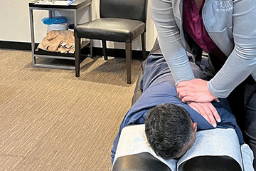 The Joint Chiropractic Greenlawn Patient Adjustment