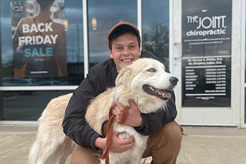 Patient outside of clinic with their dog