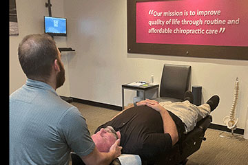The Joint Chiropractic Greenlawn Patient Adjustment
