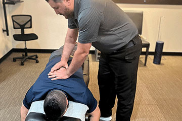 The Joint Chiropractic Greenlawn Patient Adjustment
