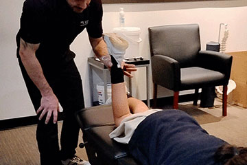 The Joint Chiropractic Greenlawn Patient Adjustment