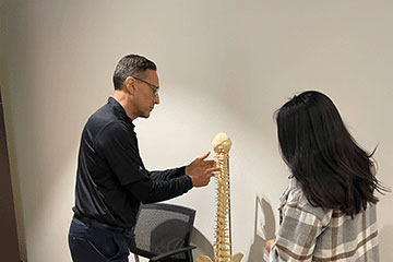 The Joint Chiropractic Irvine Crossroads Staff and Patient