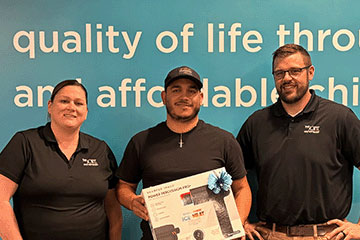 The Joint Chiropractic Wichita NE Staff and Patient